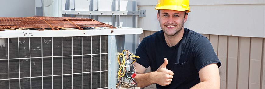 Technician showing thumbs up after AC repairing service