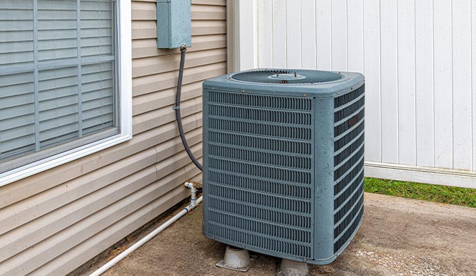 An air conditioning unit installed outside the house