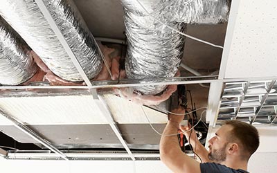 Technician testing for duct repair